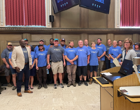 parks and recreation staff with council member at city council meeting