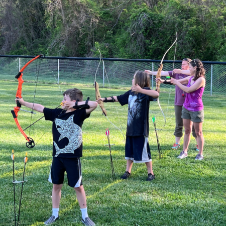 Christine Elyseev teaching bow and arrow