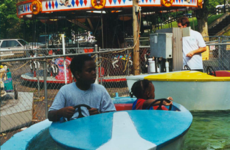 young children riding in bumper boats