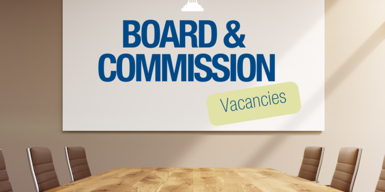board room with boards and commission vacancies written on the wall