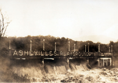 sign on bridge that says 'Asheville's Playbround'