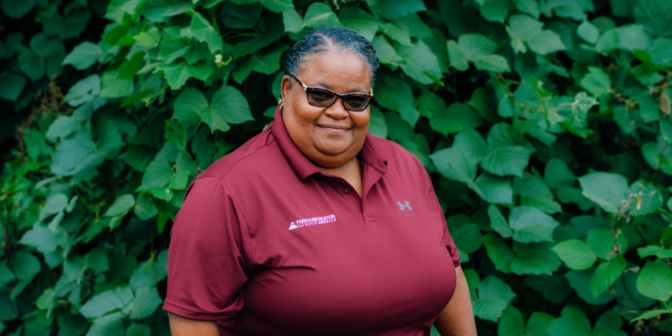 LaTonya McDowell wearing dark red Asheville Parks & Recreation polo shirt