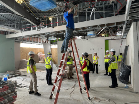 BPSS construction team member on ladder