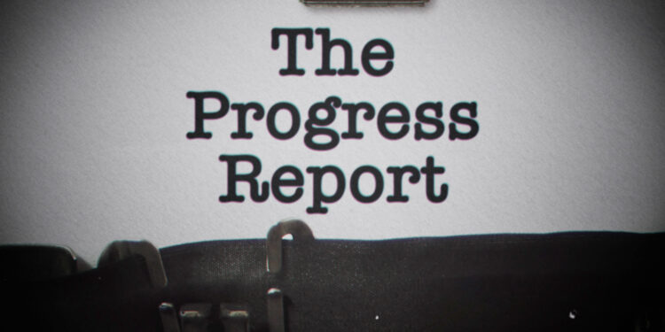 typewriter image with the words: The progress Report on the type page