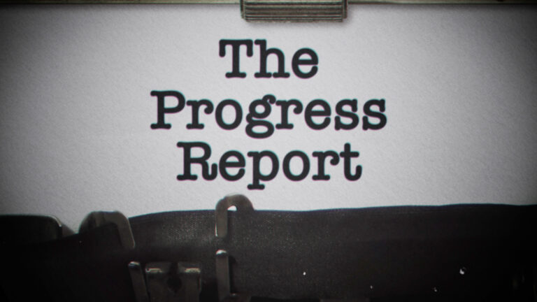 typewriter image with the words: The progress Report on the type page