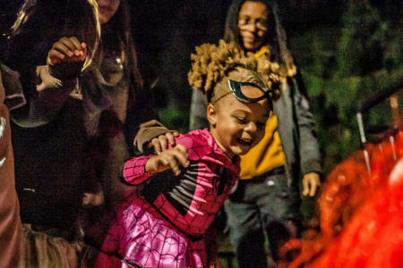 young girl in pink spider costume