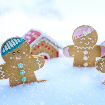 decorated gingerbread cookies in artificial snow