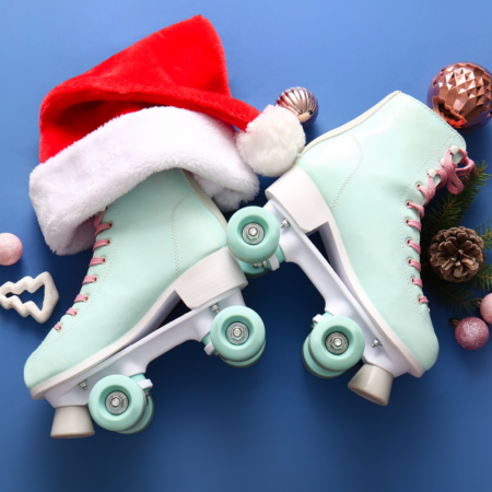 light blue roller skates and a red Santa hat